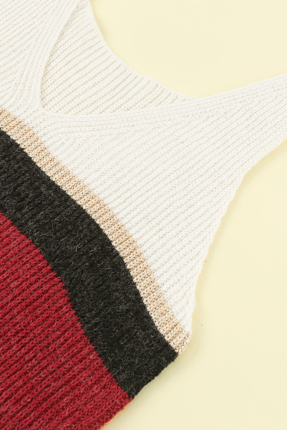 Color Block V-Neck Rib-Knit Tank displayed in a flat lay outdoors, showcasing its vibrant colors and ribbed texture.