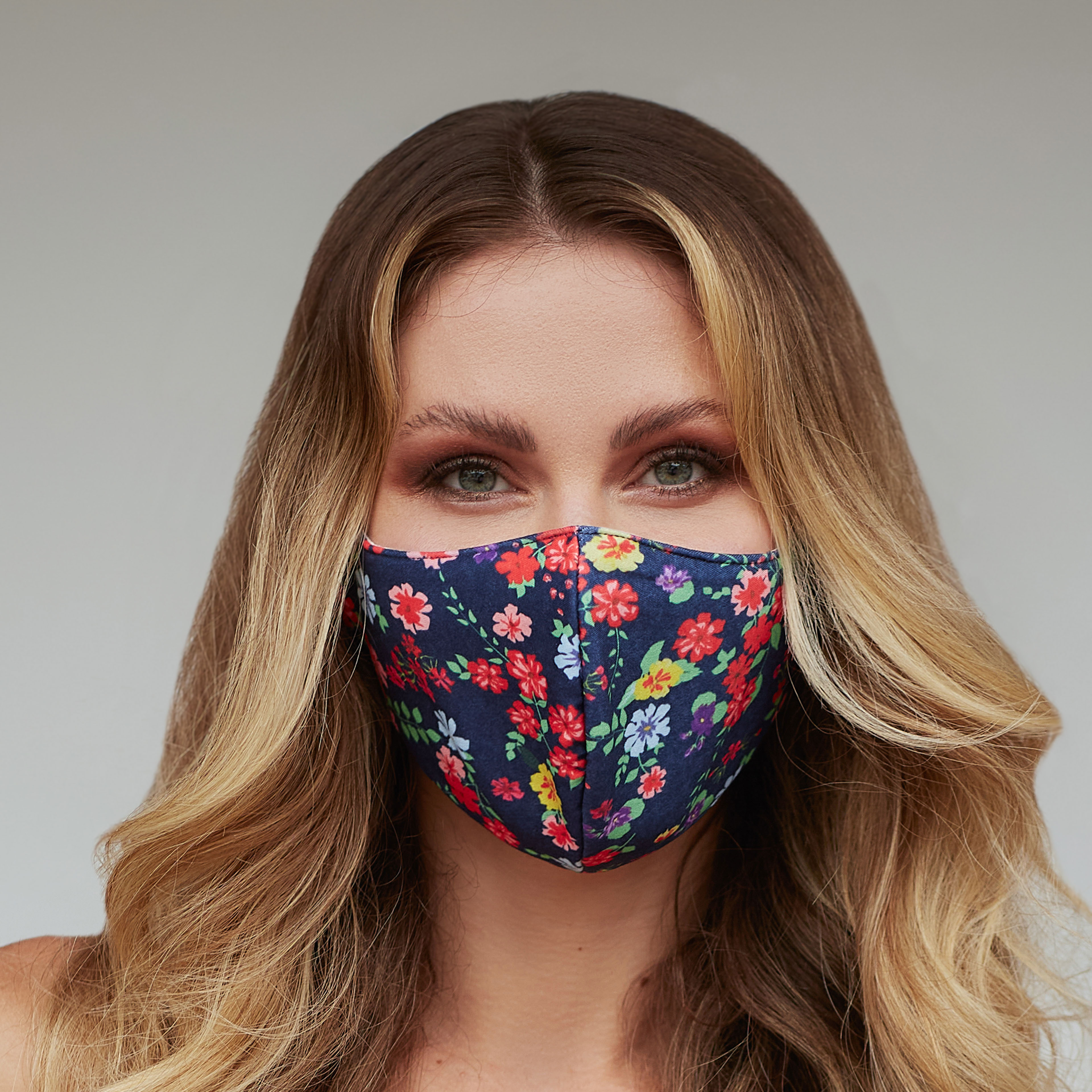 Colorful Floral Face Mask featuring vibrant floral patterns, designed for comfort and style, suitable for various activities.