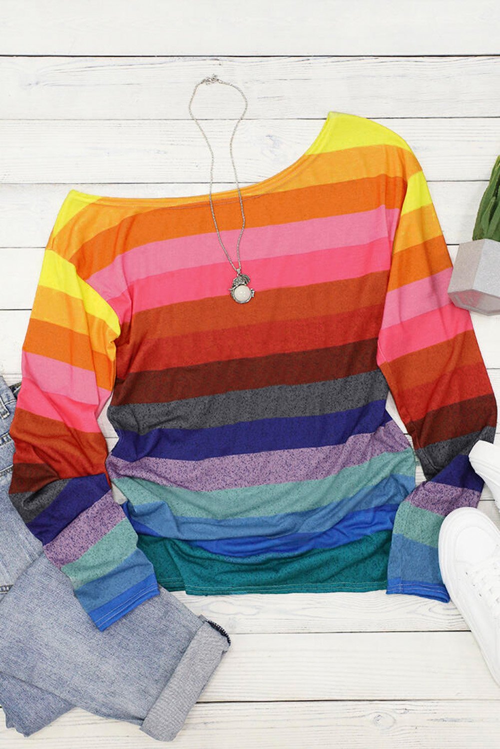 A colorful striped long sleeve top featuring a stylish slash neck design, perfect for casual wear in spring and autumn.