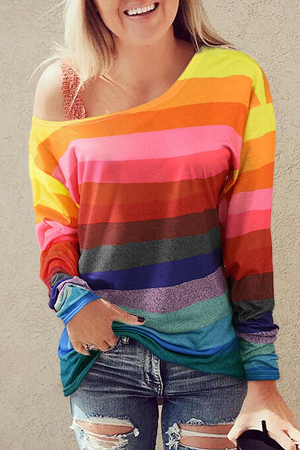 A colorful striped long sleeve top featuring a stylish slash neck design, perfect for casual wear in spring and autumn.