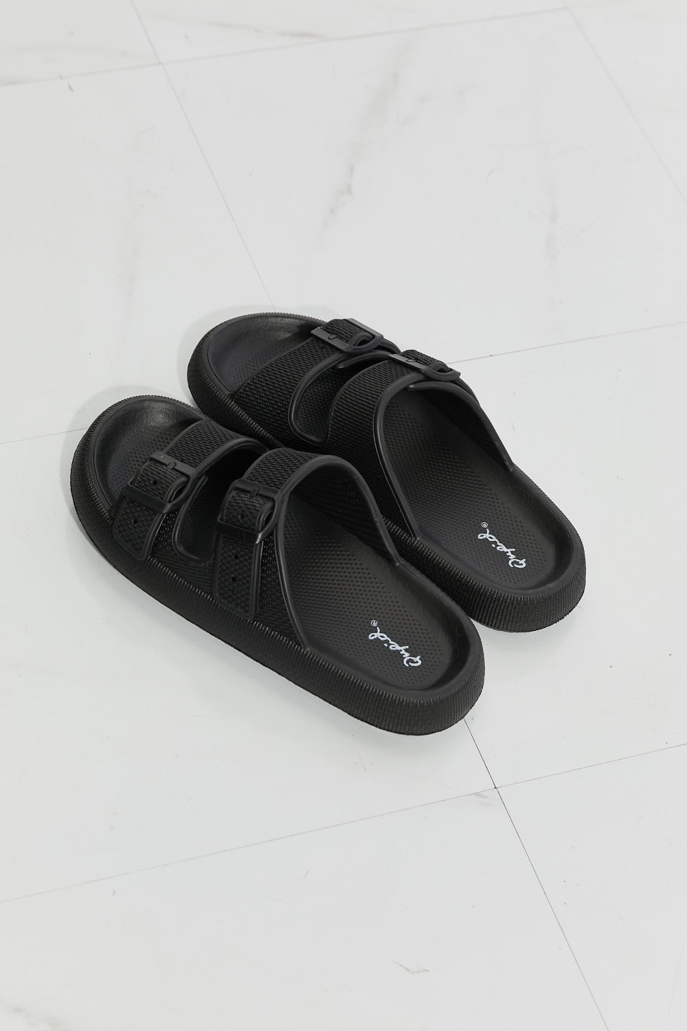 Comfy Casual Rubber Slide Sandal in Black featuring adjustable straps and a trendy platform design, perfect for summer wear.