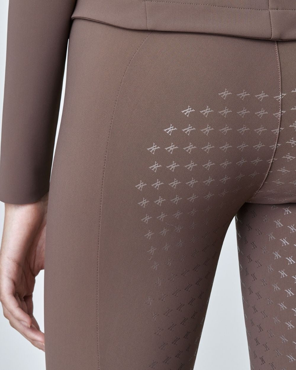 Brown Compression Pull-On Breeches designed for equestrian performance, featuring a high waist and discreet mobile phone pocket.