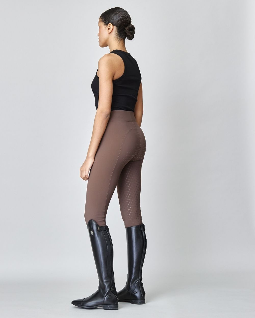 Brown Compression Pull-On Breeches designed for equestrian performance, featuring a high waist and discreet mobile phone pocket.