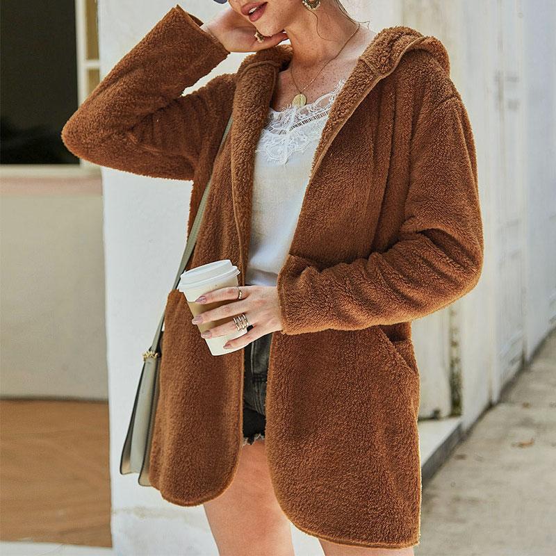 Conmoto 2019 Autumn Winter Hoodies Faux Fur Coat for women, featuring a shaggy design, pockets, and a hood for added warmth.