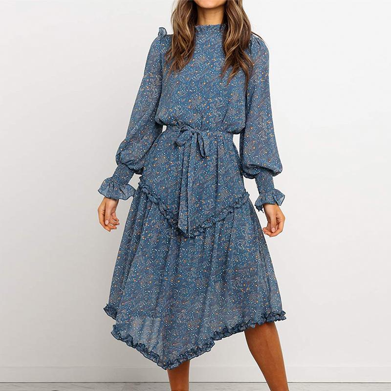 Conmoto Blue Print Turtleneck Dress featuring ruffles, lantern sleeves, and an A-line silhouette in a vibrant blue print.