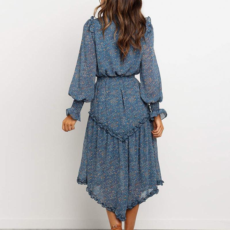 Conmoto Blue Print Turtleneck Dress featuring ruffles, lantern sleeves, and an A-line silhouette in a vibrant blue print.