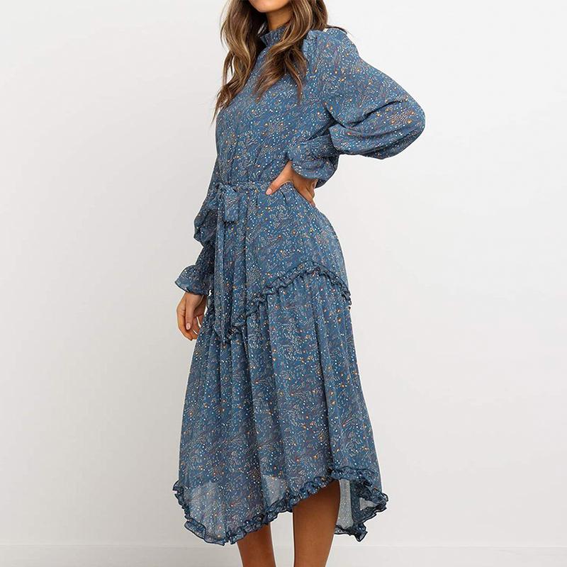 Conmoto Blue Print Turtleneck Dress featuring ruffles, lantern sleeves, and an A-line silhouette in a vibrant blue print.