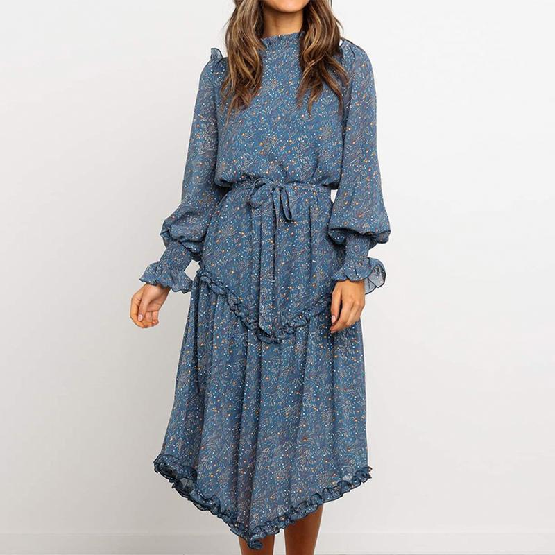 Conmoto Blue Print Turtleneck Dress featuring ruffles, lantern sleeves, and an A-line silhouette in a vibrant blue print.