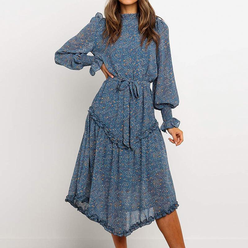 Conmoto Blue Print Turtleneck Dress featuring ruffles, lantern sleeves, and an A-line silhouette in a vibrant blue print.