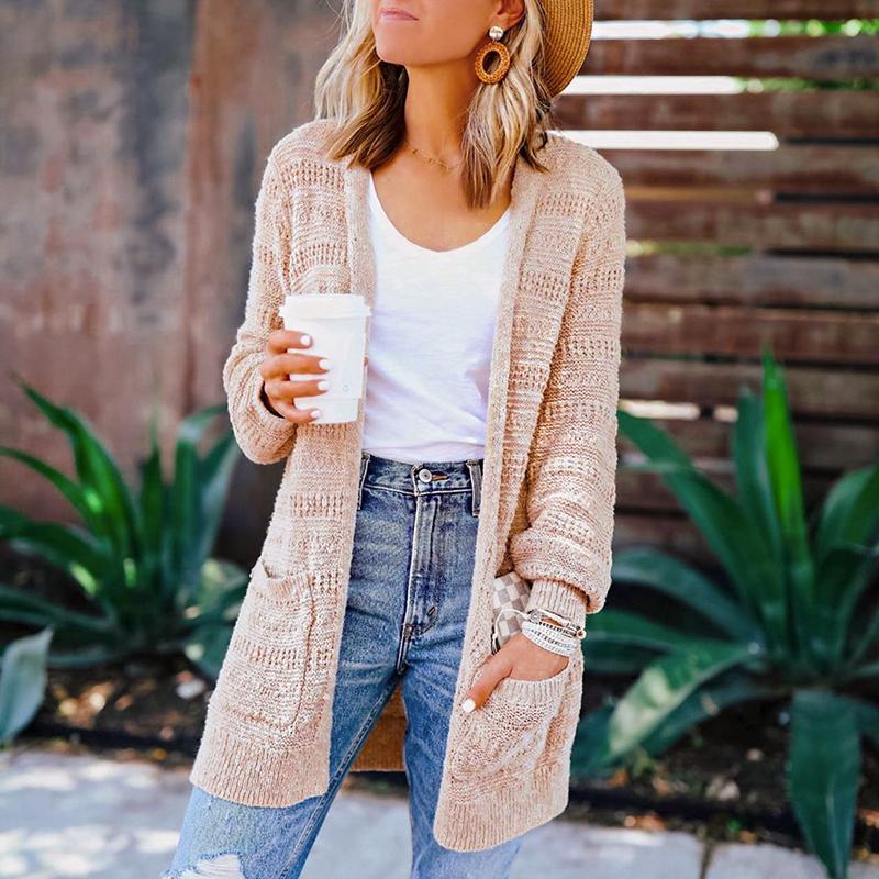 A stylish Conmoto Winter Long Cardigan for women, featuring a solid pattern, irregular collar, and convenient pockets, perfect for casual winter wear.