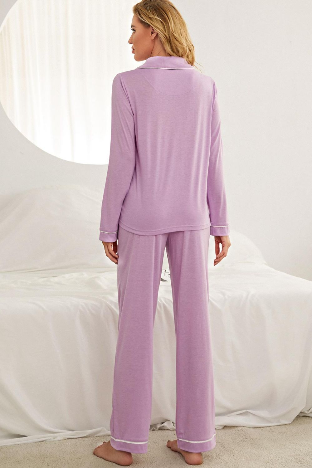 Contrast piping button down top and pants loungewear set displayed in a studio setting, showcasing its minimalist design and elegant features.