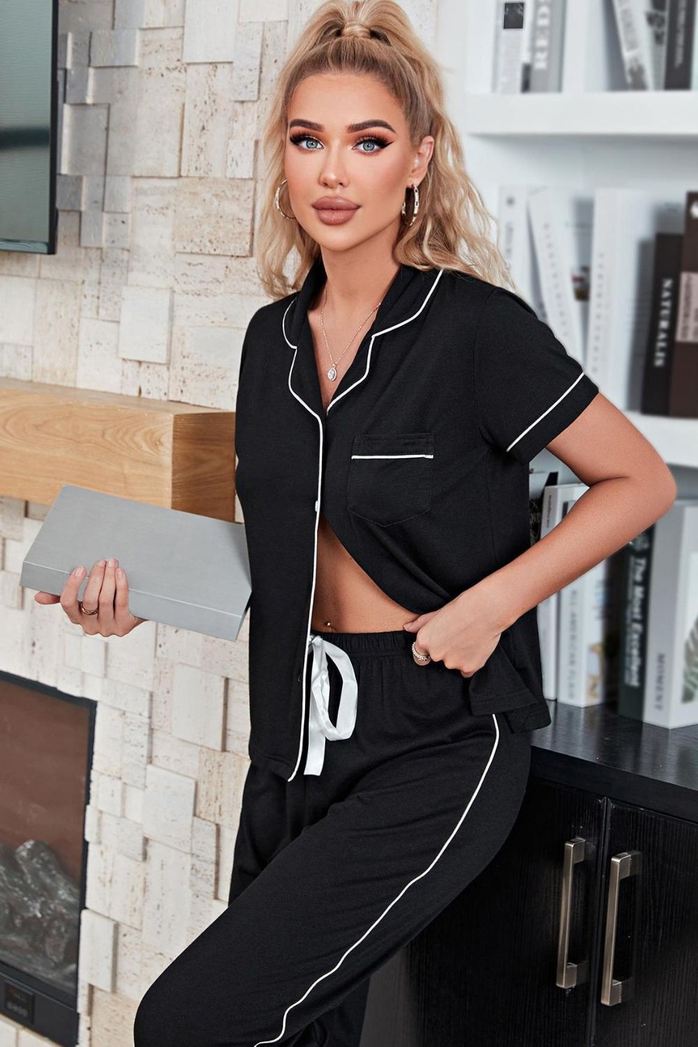 Contrast Piping Short Sleeve Top and Pants Pajama Set displayed on a mannequin in a studio setting, showcasing its minimalist design and elegant lapel collar.