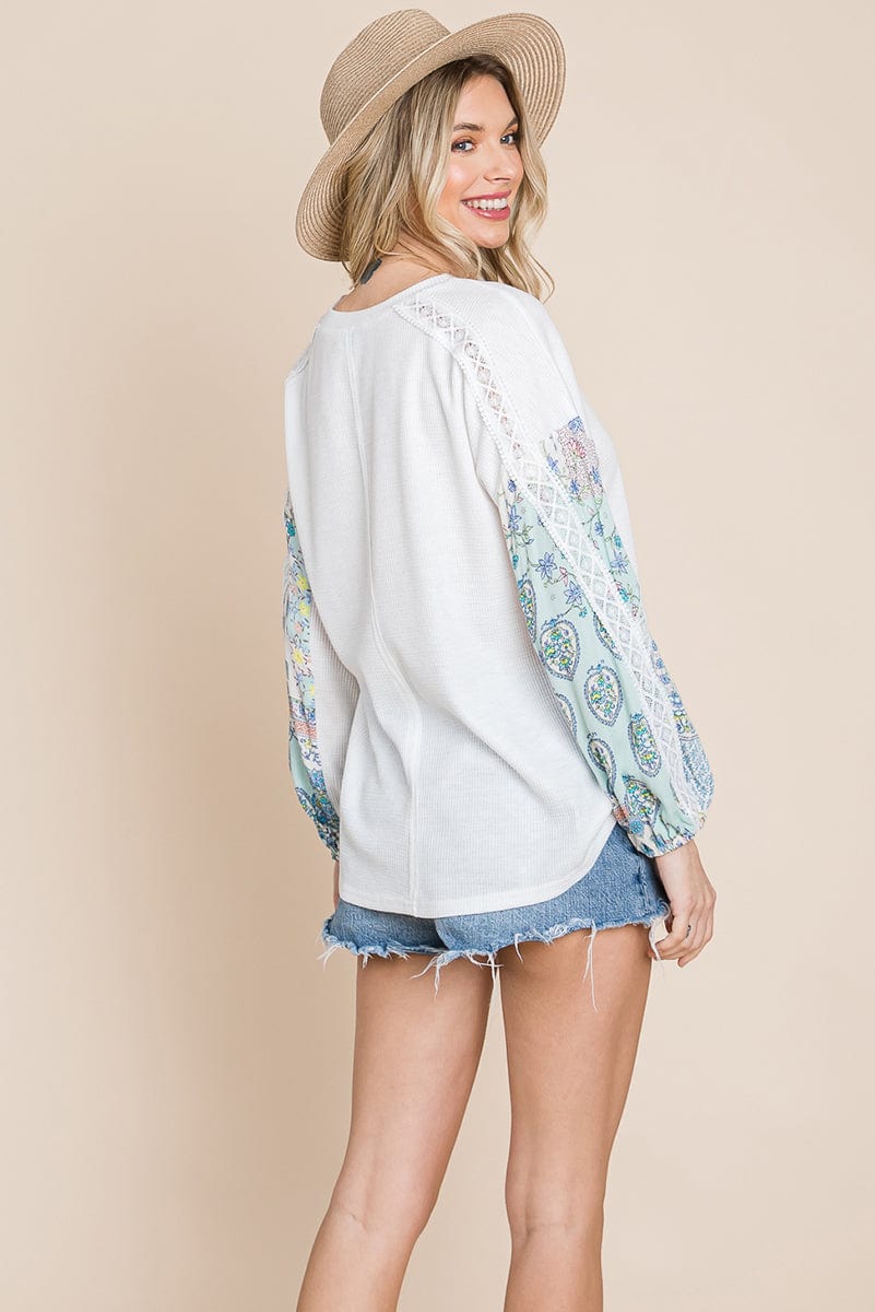 Contrasting Blossom Sleeve Waffle Knit Top featuring floral patchwork sleeves and a boat neck design, perfect for casual wear.