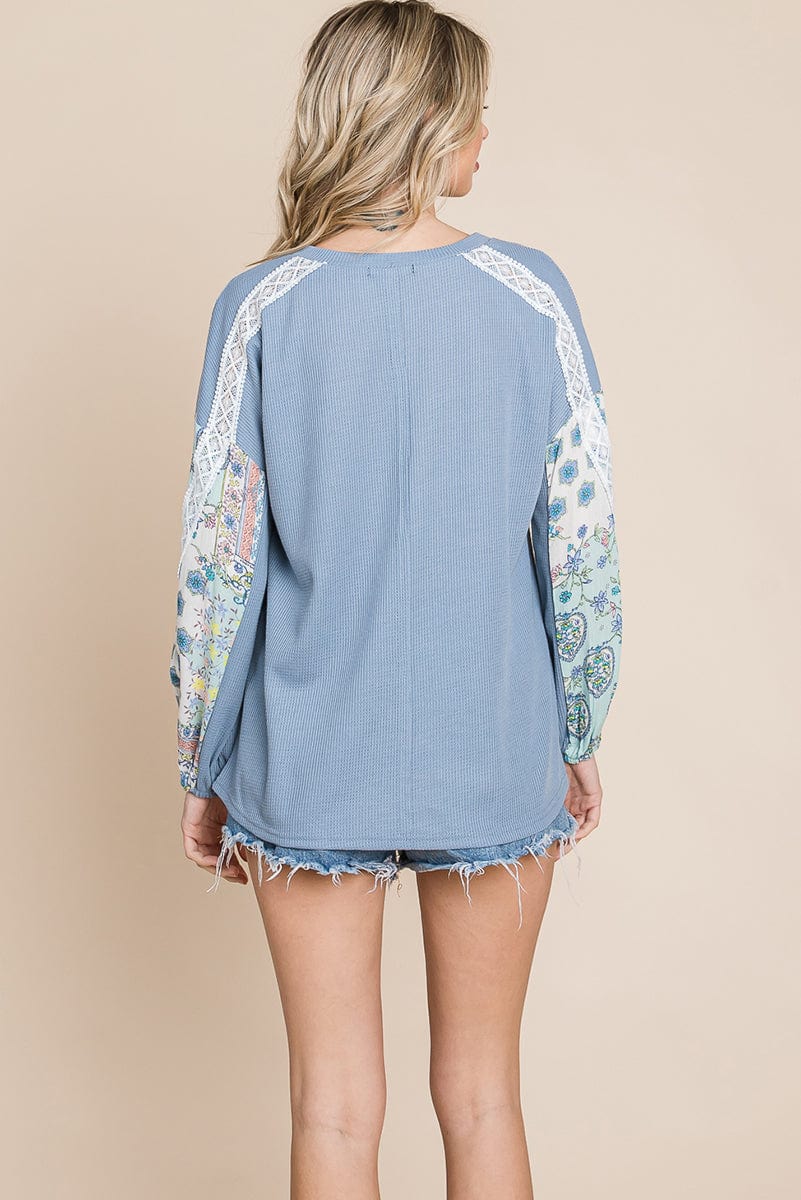 Contrasting Blossom Sleeve Waffle Knit Top featuring floral patchwork sleeves and a boat neck design, perfect for casual wear.