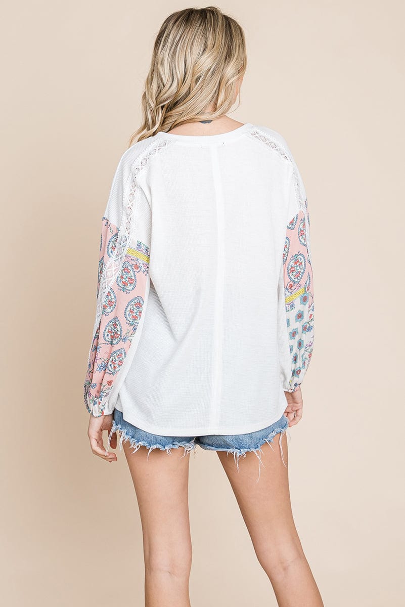 Contrasting Blossom Sleeve Waffle Knit Top featuring floral patchwork sleeves and a boat neck design, perfect for casual wear.