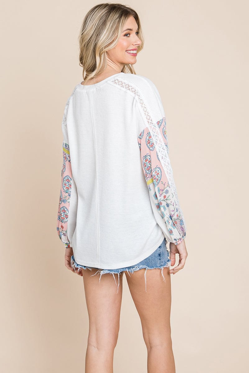 Contrasting Blossom Sleeve Waffle Knit Top featuring floral patchwork sleeves and a boat neck design, perfect for casual wear.