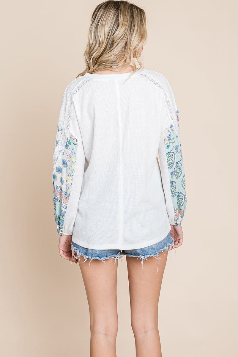 Contrasting Blossom Sleeve Waffle Knit Top featuring floral patchwork sleeves and a boat neck design, perfect for casual wear.