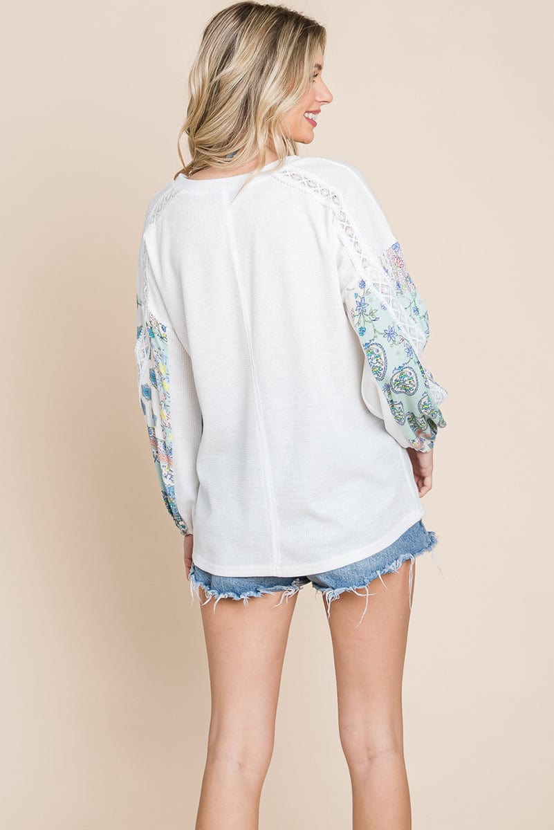 Contrasting Blossom Sleeve Waffle Knit Top featuring floral patchwork sleeves and a boat neck design, perfect for casual wear.