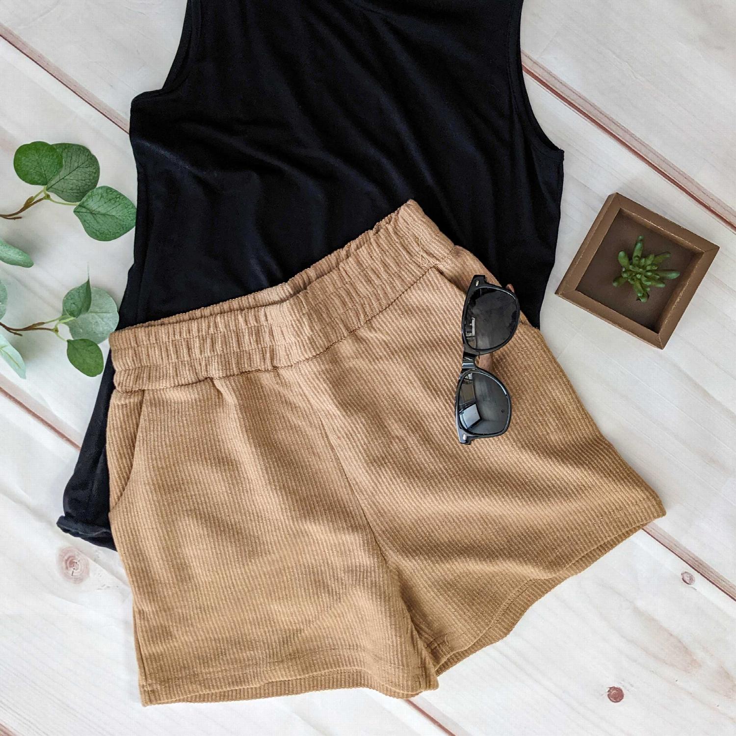 A pair of stylish Cord Fabric High Rised Shorts in a soft fabric, featuring a ribbed elastic waistband and hip pockets, perfect for summer wear.