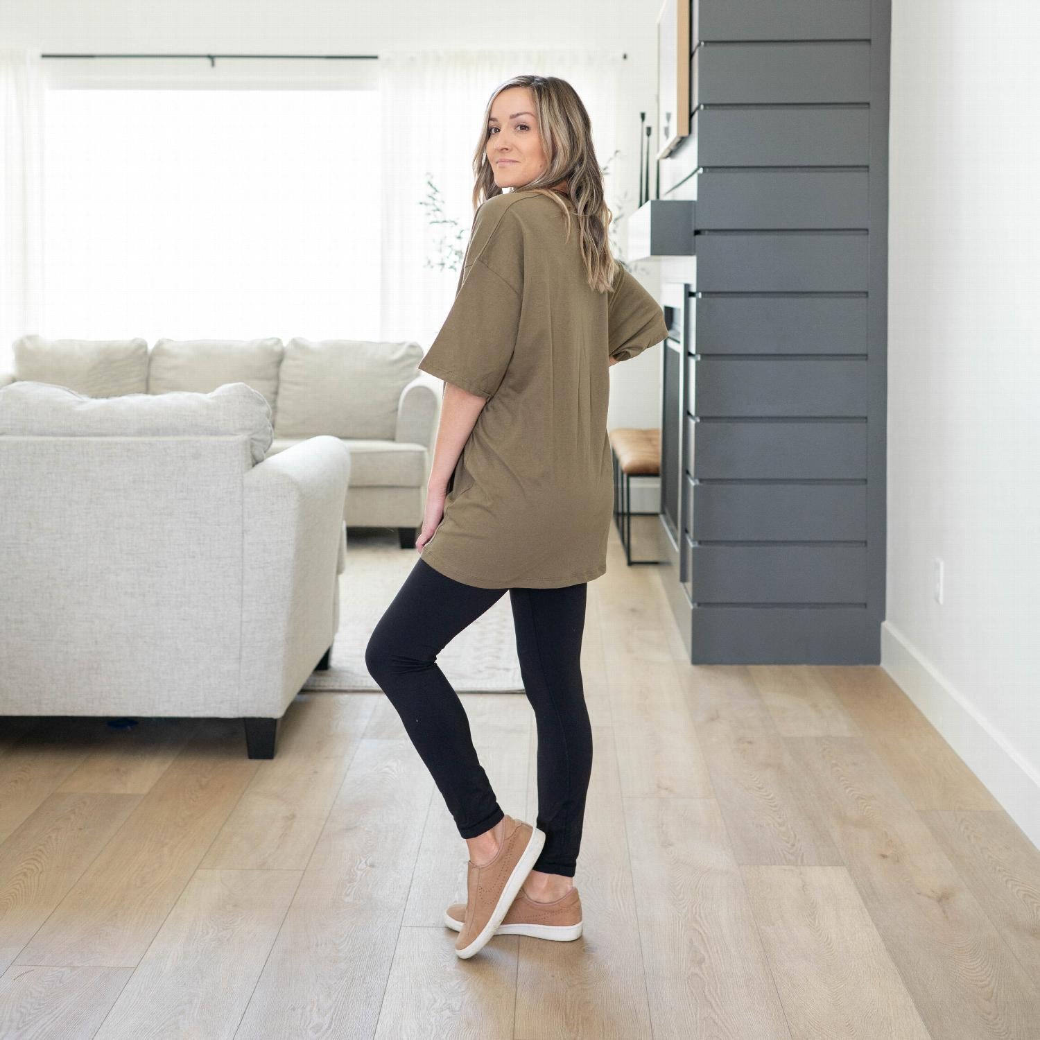 A model wearing a Cotton Drop Shoulder Boyfriend Box Tee in a vibrant color, showcasing its oversized fit and relaxed style.