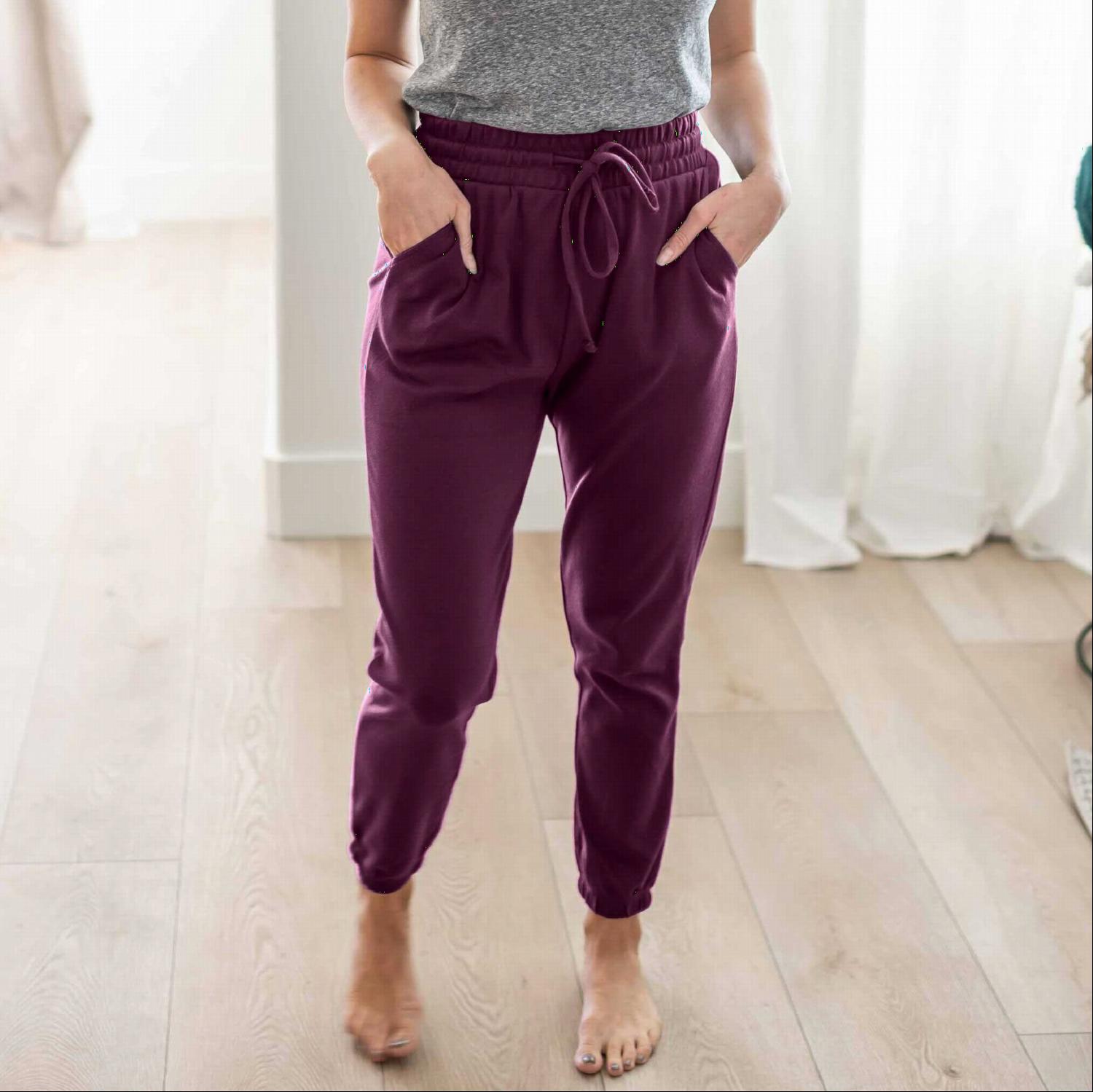 A pair of stylish Cotton Jogger Pants in various colors, showcasing the drawstring waist and fitted ankles.