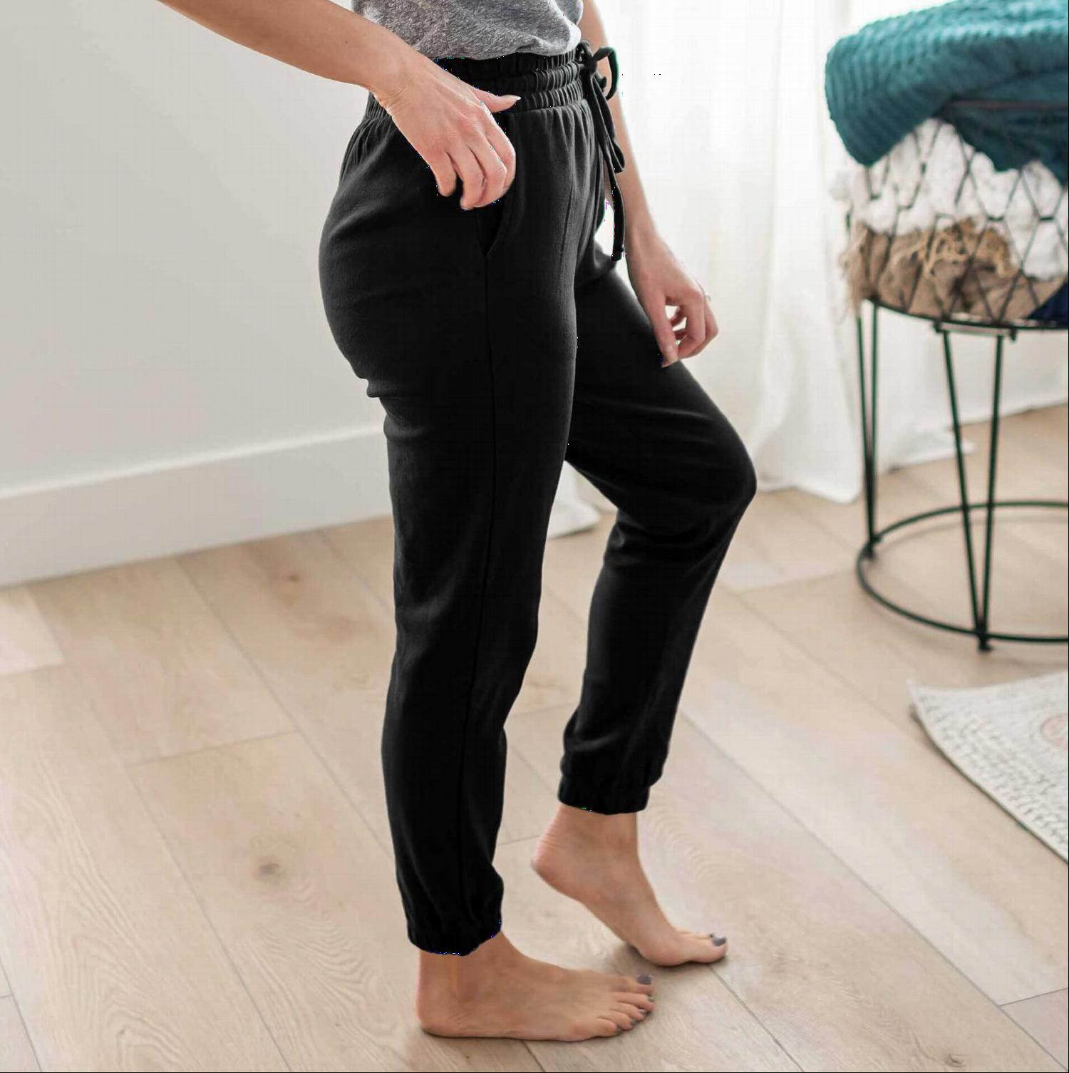 A pair of stylish Cotton Jogger Pants in various colors, showcasing the drawstring waist and fitted ankles.