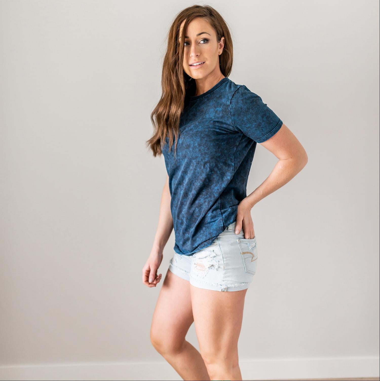 A stylish Cotton Short Sleeve Round Neck Top in solid color, showcasing its scoop neck design and short sleeves, perfect for summer wear.