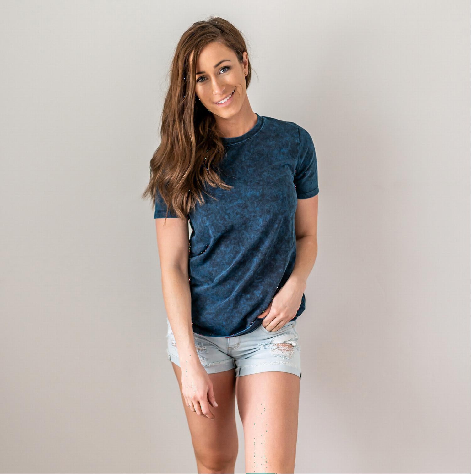 A stylish Cotton Short Sleeve Round Neck Top in solid color, showcasing its scoop neck design and short sleeves, perfect for summer wear.