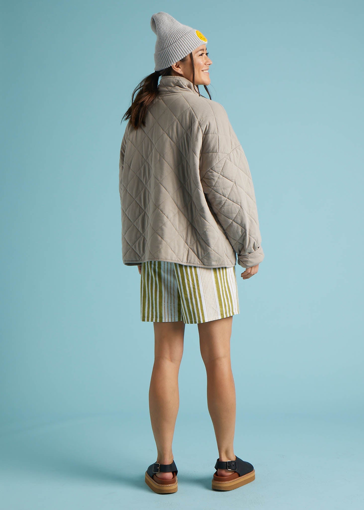 A stylish Countryside Quilted Jacket in Pebble color, featuring quilted stitching, front slip pockets, and a relaxed design, perfect for layering.