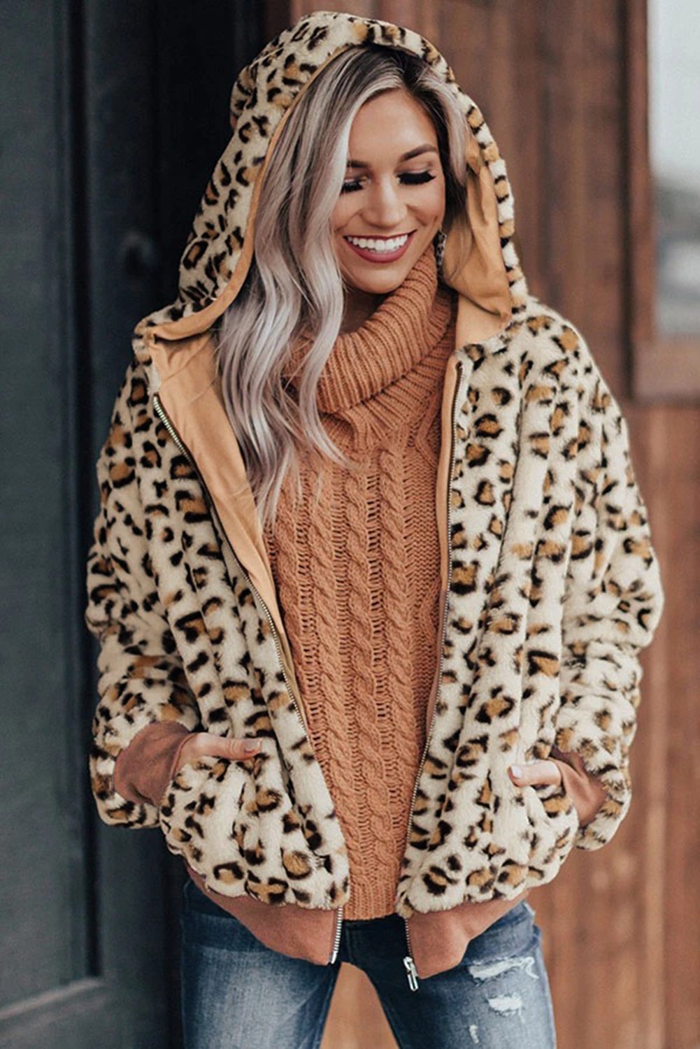 Cozy Plush Leopard Jacket featuring ultra-soft faux fur, bold leopard print, and a hooded back with hidden side pockets.