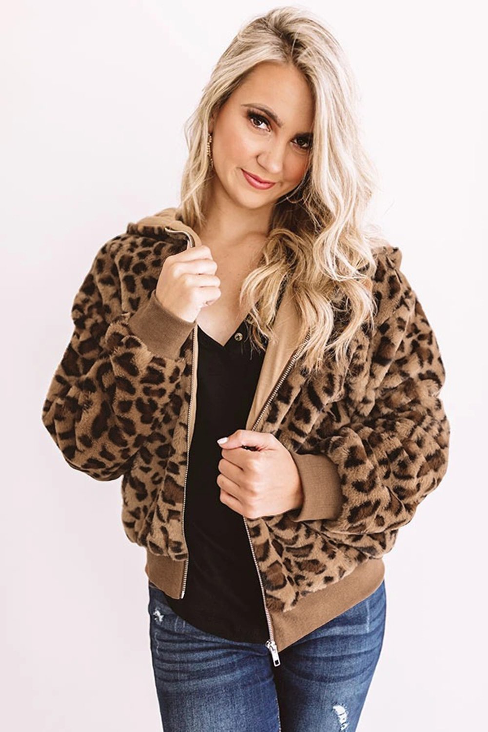 Cozy Plush Leopard Jacket featuring ultra-soft faux fur, bold leopard print, and a hooded back with hidden side pockets.