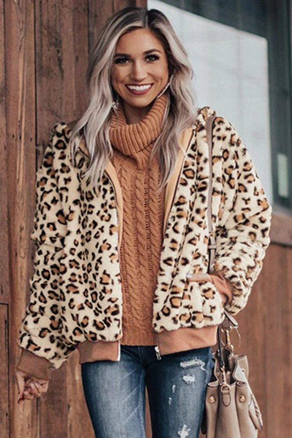 Cozy Plush Leopard Jacket featuring ultra-soft faux fur, bold leopard print, and a hooded back with hidden side pockets.