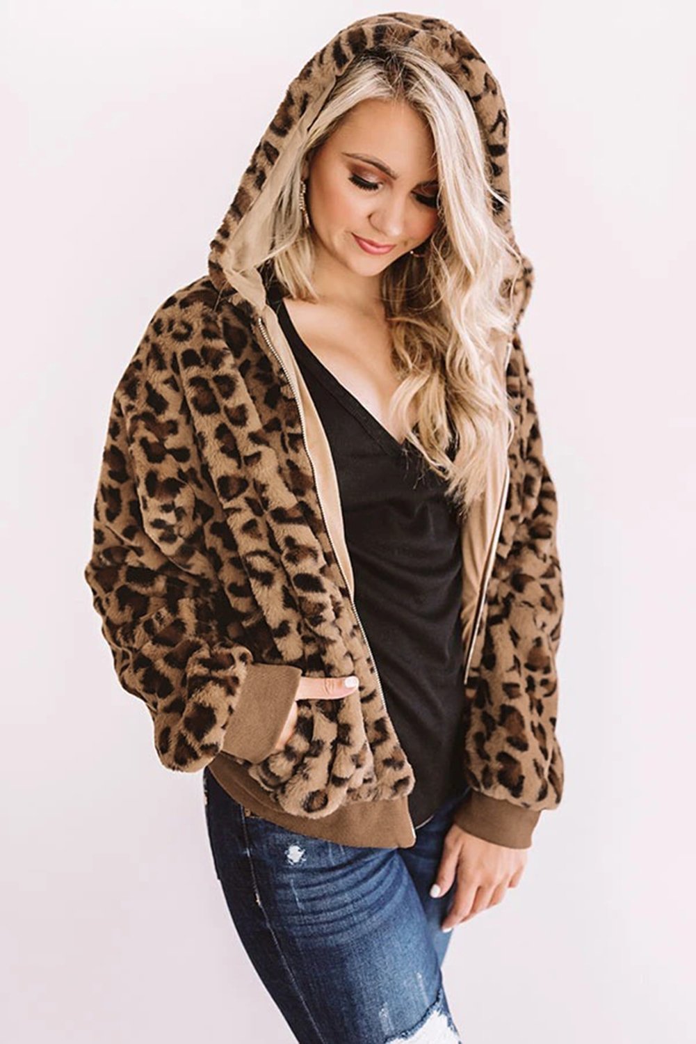 Cozy Plush Leopard Jacket featuring ultra-soft faux fur, bold leopard print, and a hooded back with hidden side pockets.