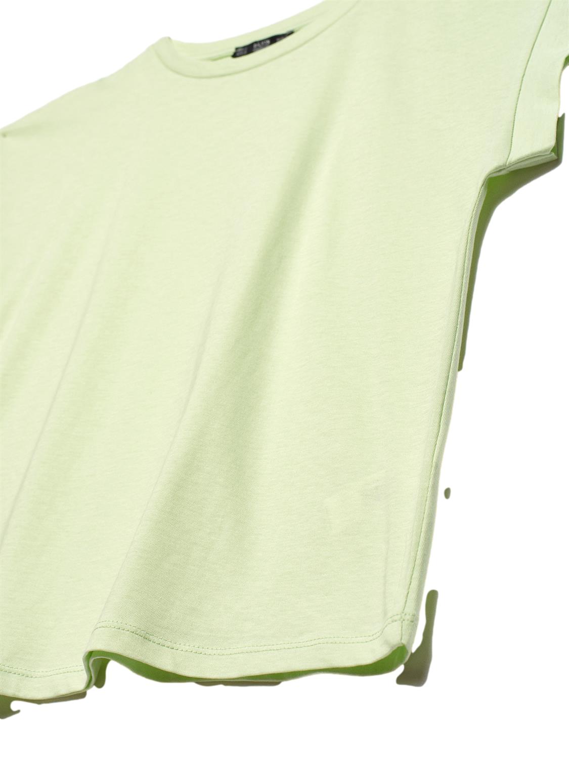 A soft and comfortable crew neck combed t-shirt made from 100% cotton, displayed in a neutral color, showcasing its classic design.