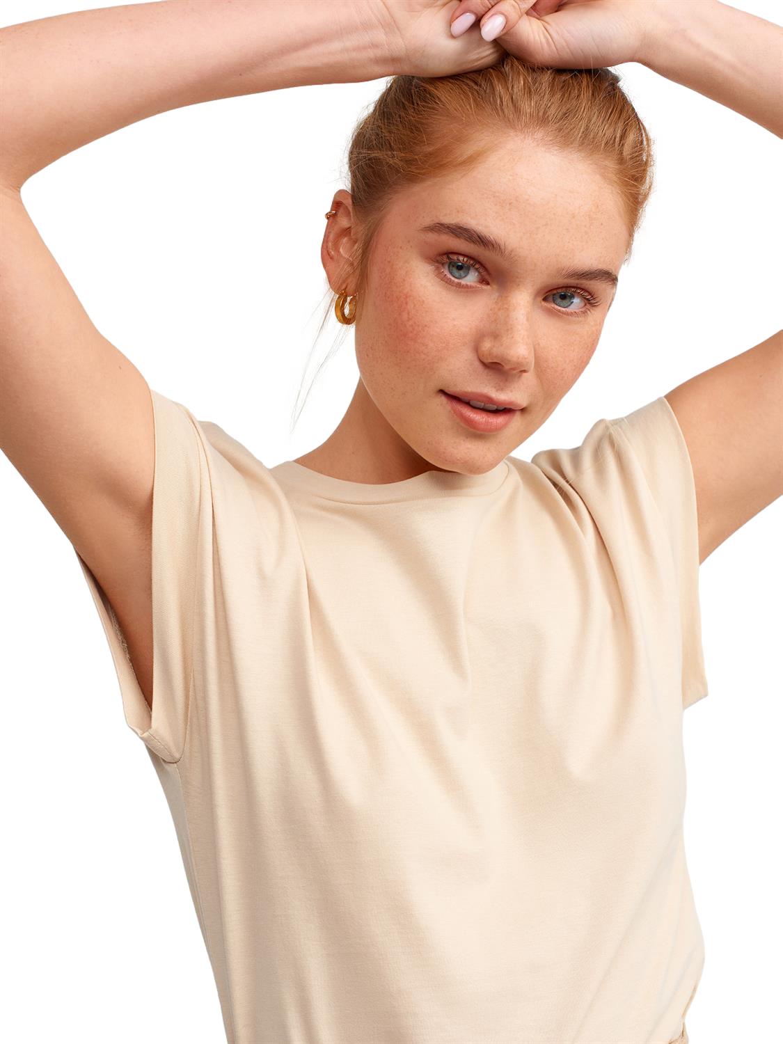 A soft and comfortable crew neck combed t-shirt made from 100% cotton, displayed in a neutral color, showcasing its classic design.