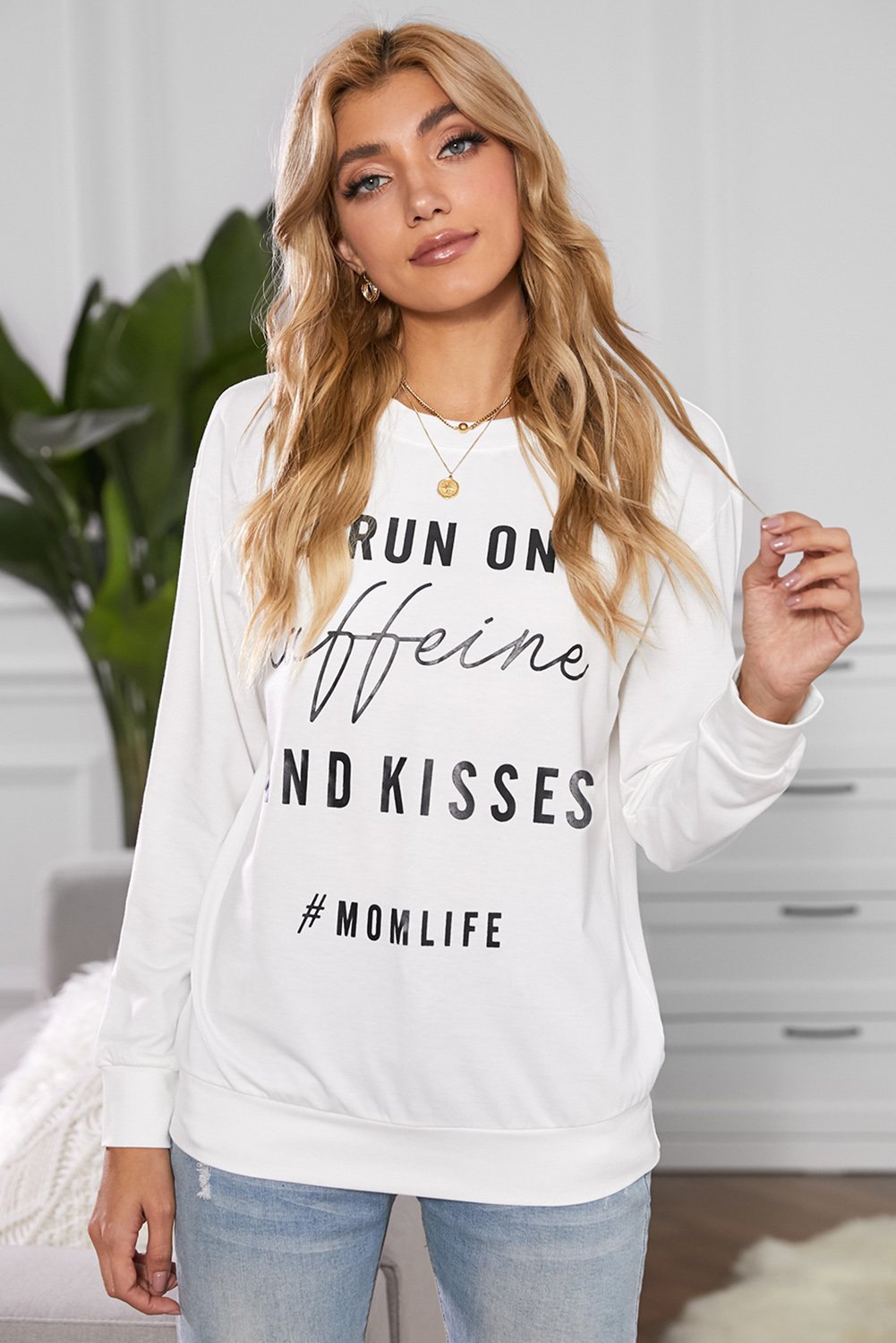 A stylish crew neck sweatshirt featuring a fun letter print design, perfect for casual wear and lounging, displayed in a relaxed fit.