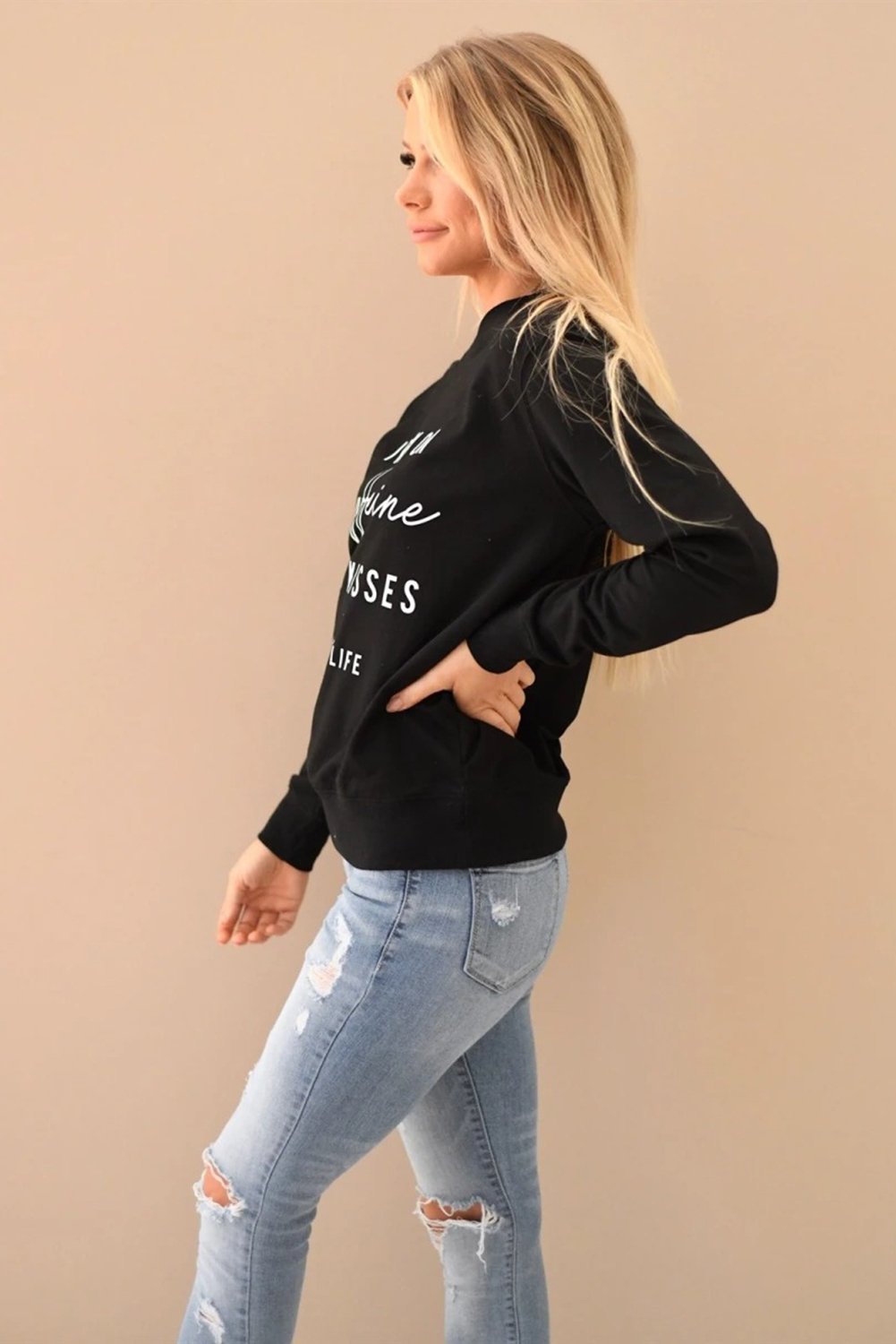 A stylish crew neck sweatshirt featuring a fun letter print design, perfect for casual wear and lounging, displayed in a relaxed fit.