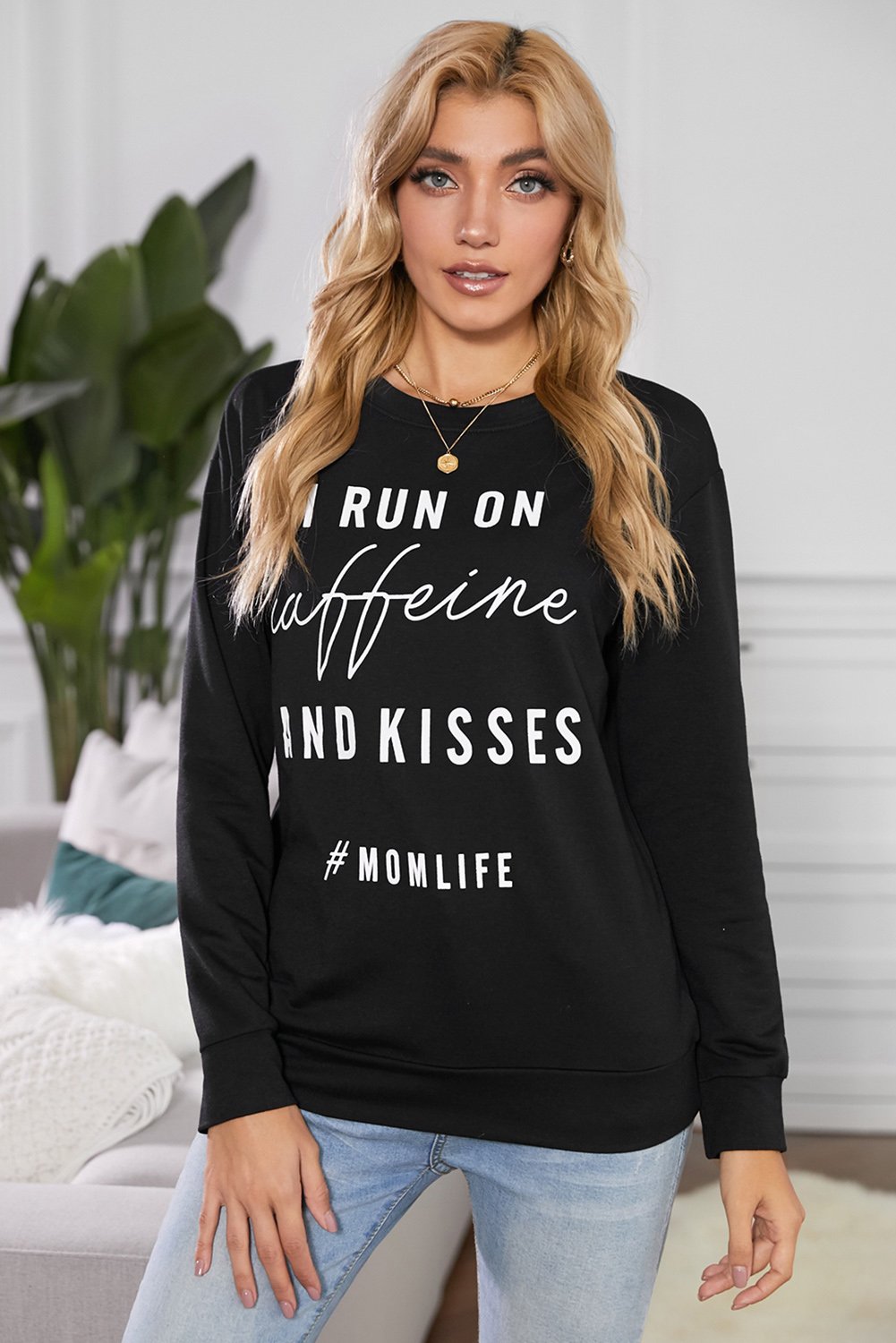 A stylish crew neck sweatshirt featuring a fun letter print design, perfect for casual wear and lounging, displayed in a relaxed fit.