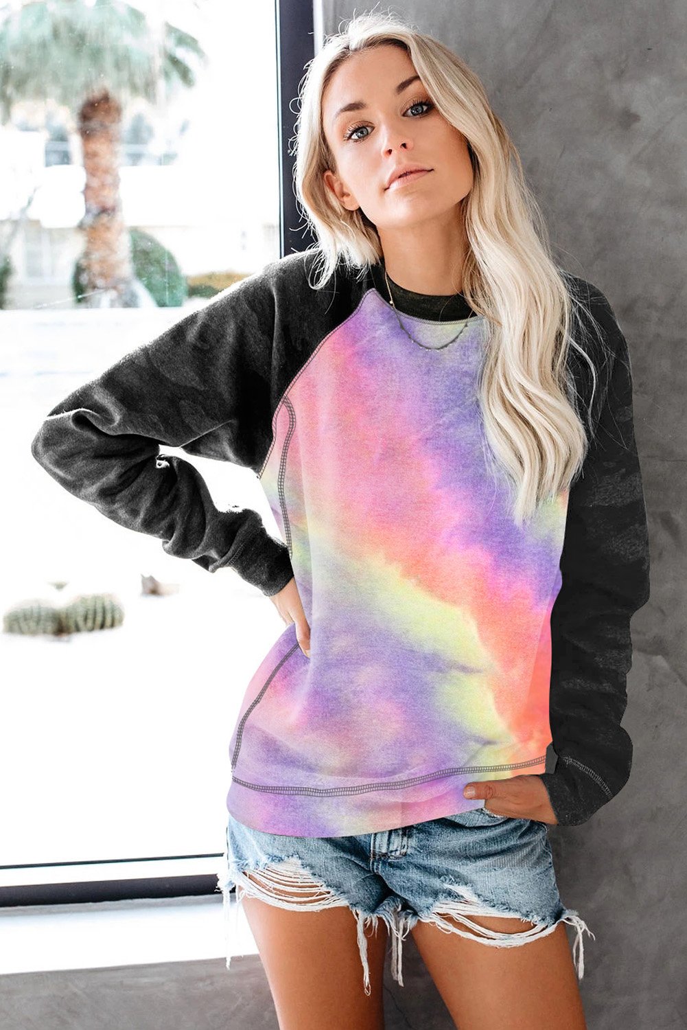 A stylish crewneck sweatshirt featuring a trendy camo print design, perfect for casual wear.