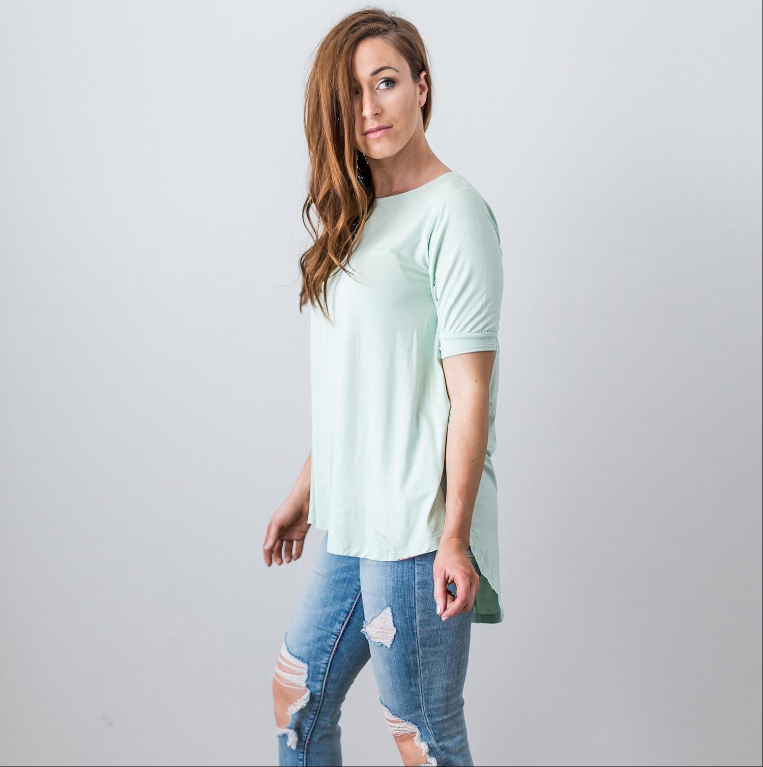 A stylish Criss Cross Back Hi-Low Scoop Hem Top in soft fabric, featuring three-quarter sleeves and a flattering fit, perfect for spring and summer wear.