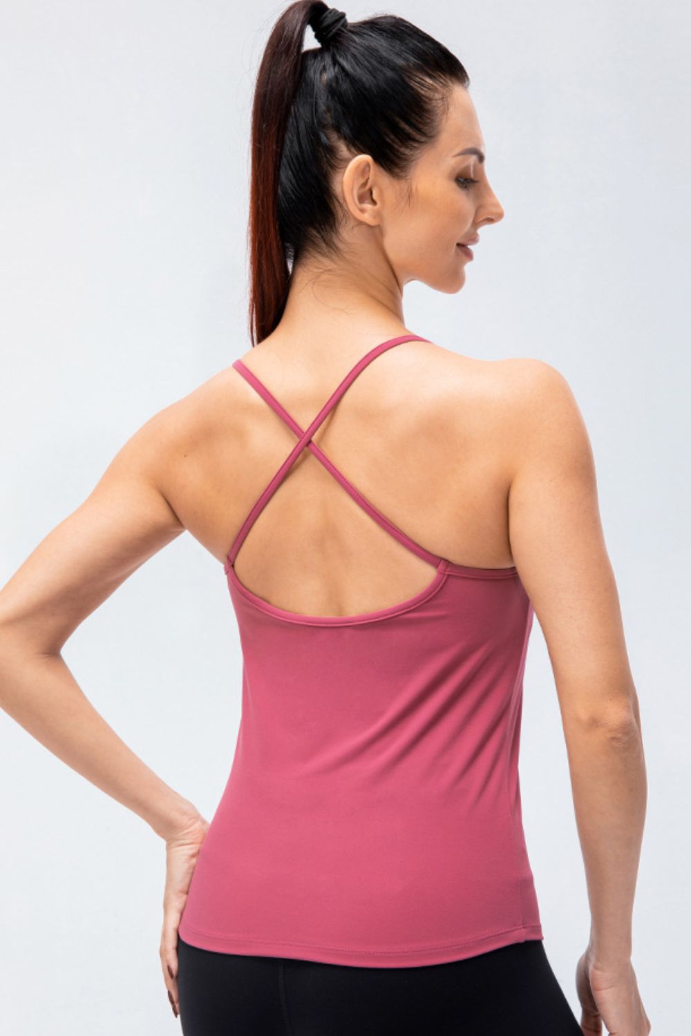 Crisscross Back Spaghetti Strap Yoga Cami in solid color, showcasing its stylish design and removable padding.