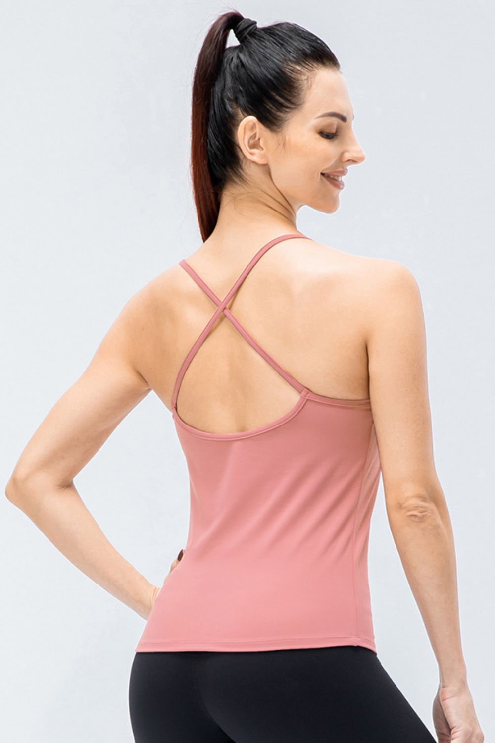 Crisscross Back Spaghetti Strap Yoga Cami in solid color, showcasing its stylish design and removable padding.