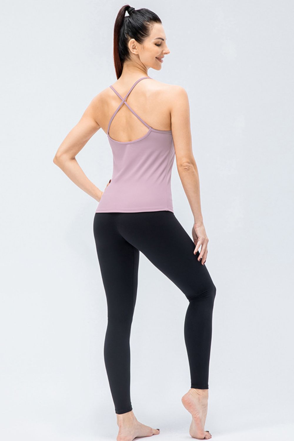 Crisscross Back Spaghetti Strap Yoga Cami in solid color, showcasing its stylish design and removable padding.