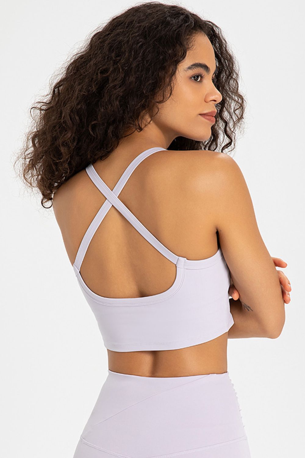 Crisscross Back V-Neck Sports Bra in solid color, showcasing its stylish design and comfortable fit, perfect for yoga and workouts.