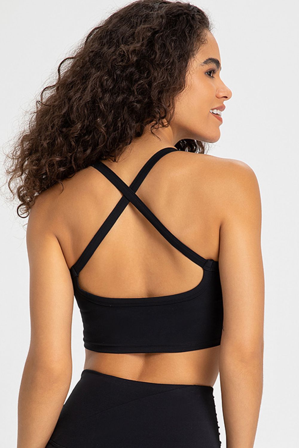 Crisscross Back V-Neck Sports Bra in solid color, showcasing its stylish design and comfortable fit, perfect for yoga and workouts.