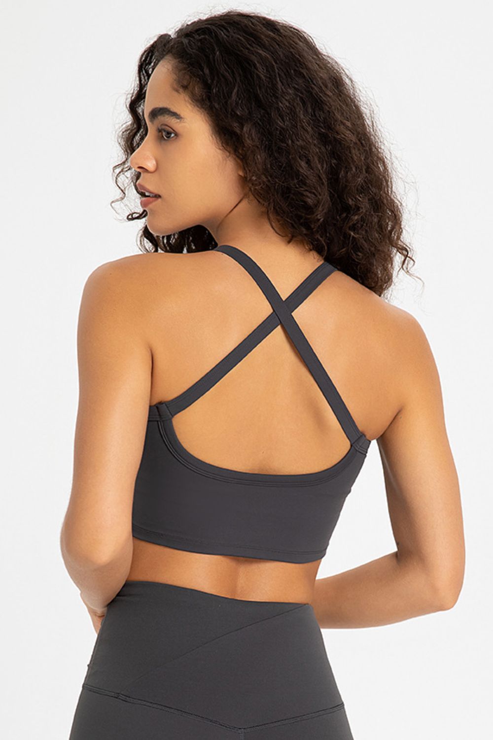 Crisscross Back V-Neck Sports Bra in solid color, showcasing its stylish design and comfortable fit, perfect for yoga and workouts.