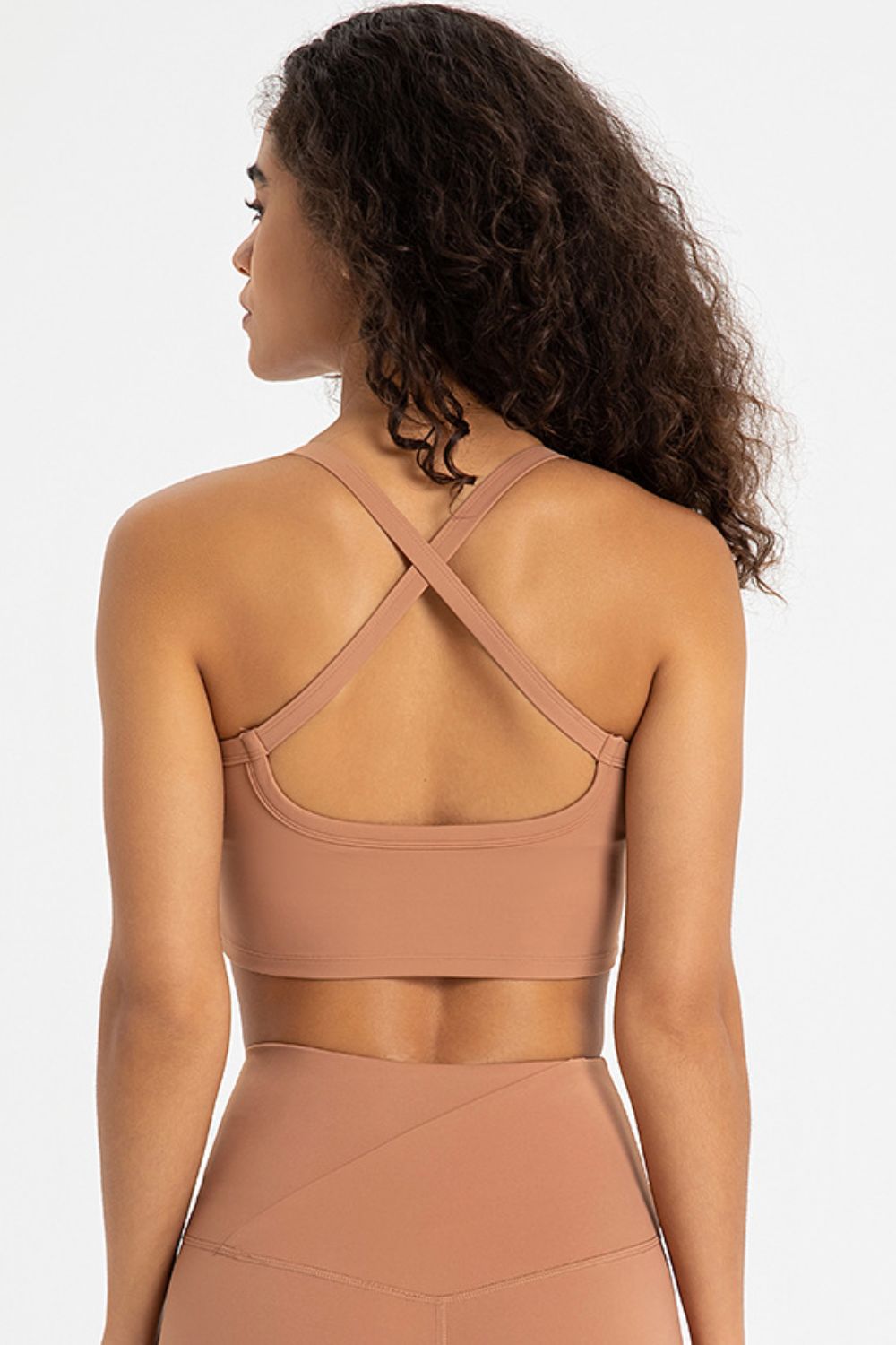 Crisscross Back V-Neck Sports Bra in solid color, showcasing its stylish design and comfortable fit, perfect for yoga and workouts.