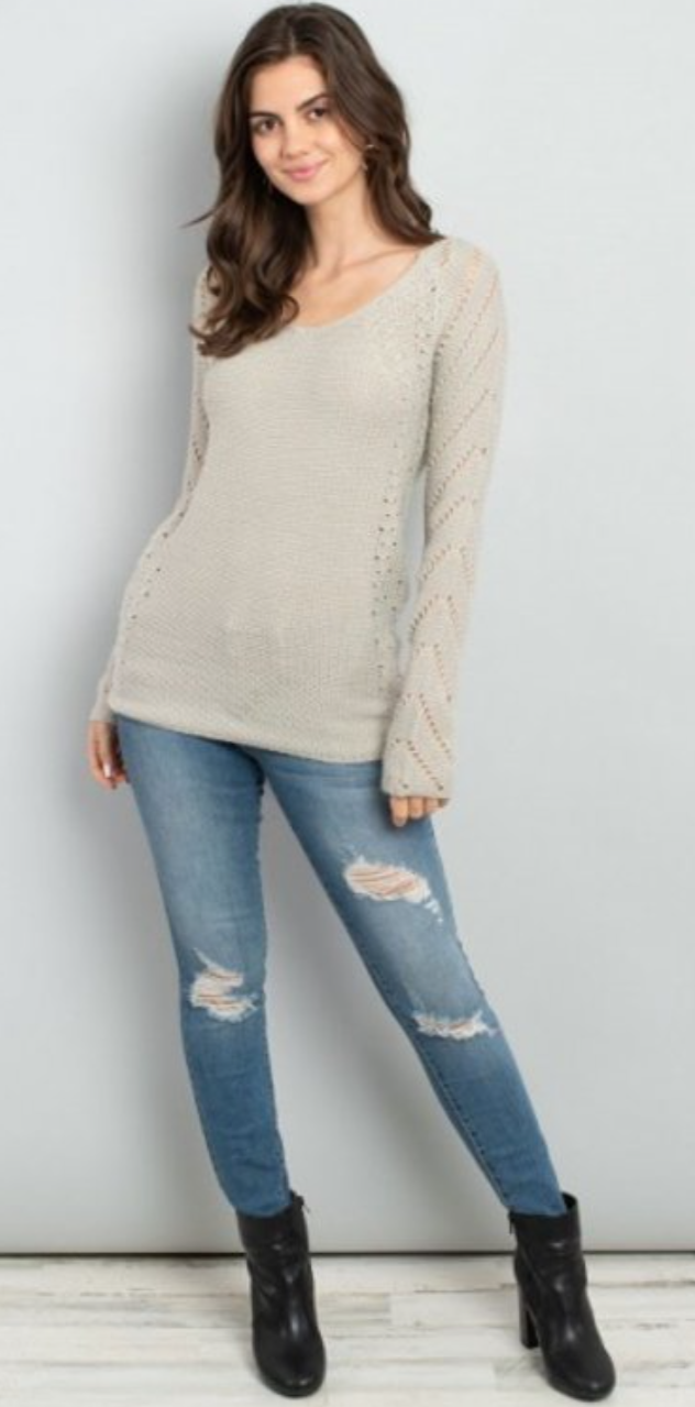 A stylish Crochet Detail Sweater featuring long sleeves, a v-neck, and intricate crochet knit details, perfect for casual and formal wear.