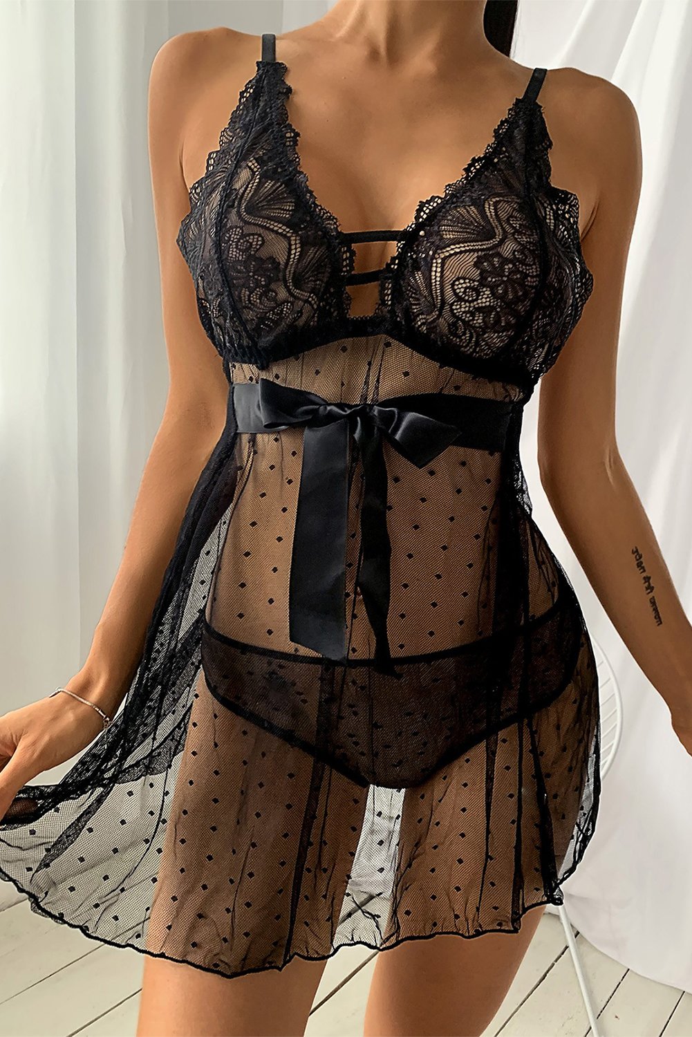 A seductive Crochet Lace Bowknot Dot Mesh Slit Babydoll featuring floral lace and dotted mesh, perfect for romantic occasions.