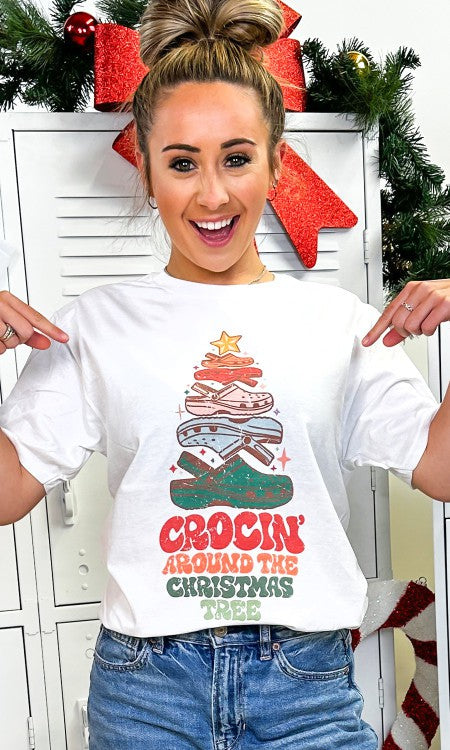 Crockin' Around the Christmas Tree Graphic T-Shirt featuring a colorful croc design shaped like a Christmas tree.